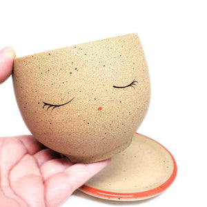 Planter - Peaceful Face (Red Saucer) by Jennifer Fujimoto