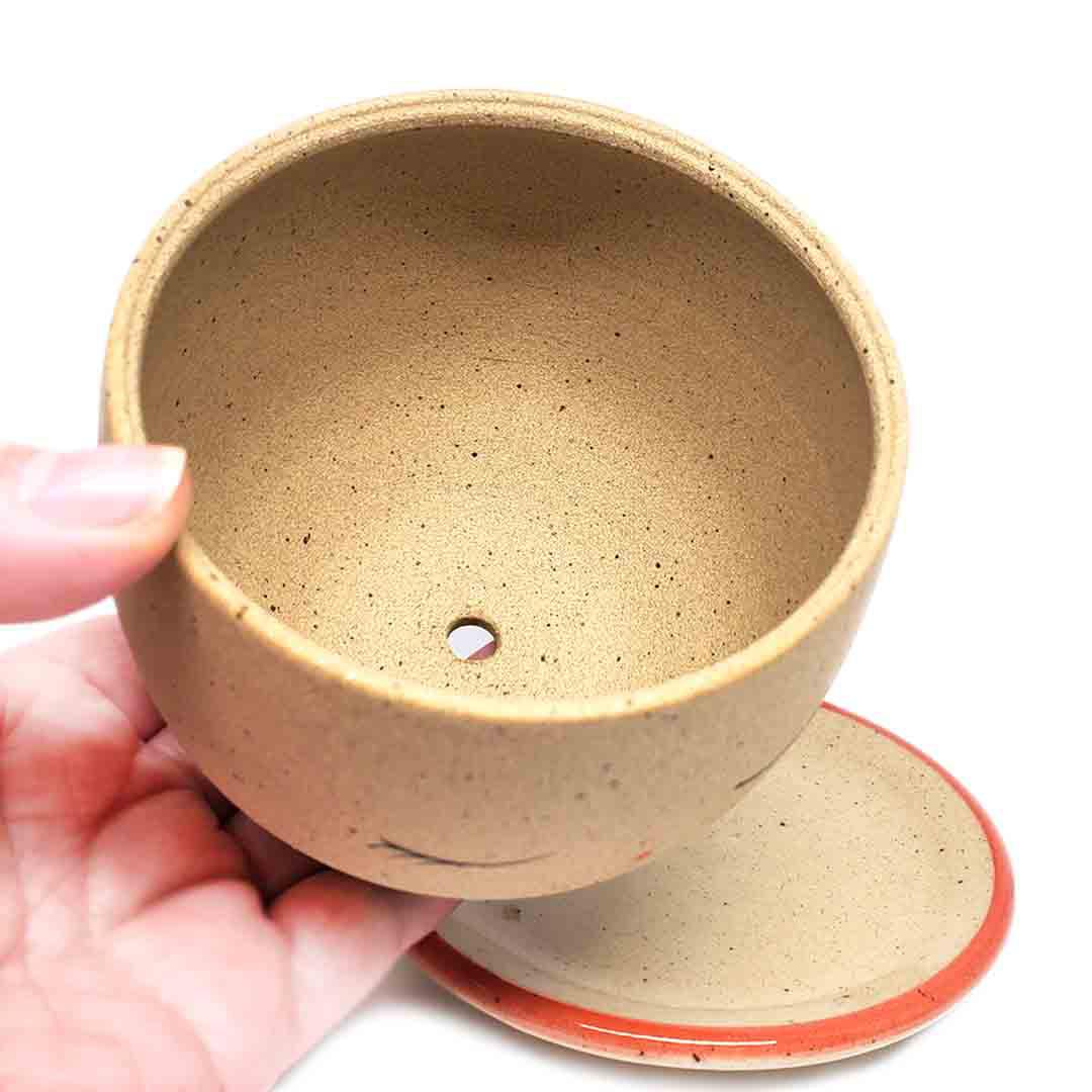 Planter - Peaceful Face (Red Saucer) by Jennifer Fujimoto