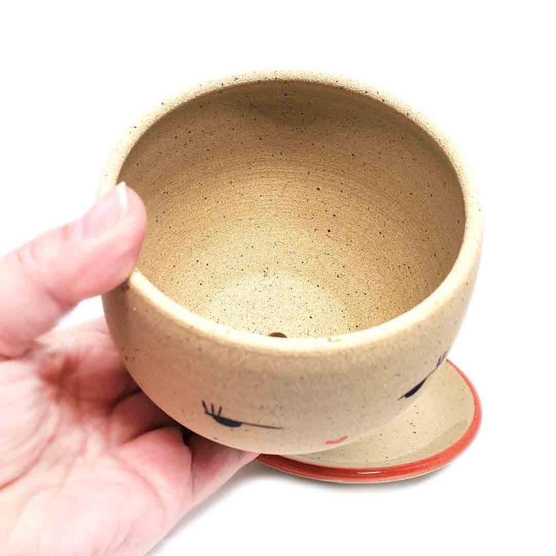 Planter - Side Eye Face (Red Saucer) by Jennifer Fujimoto