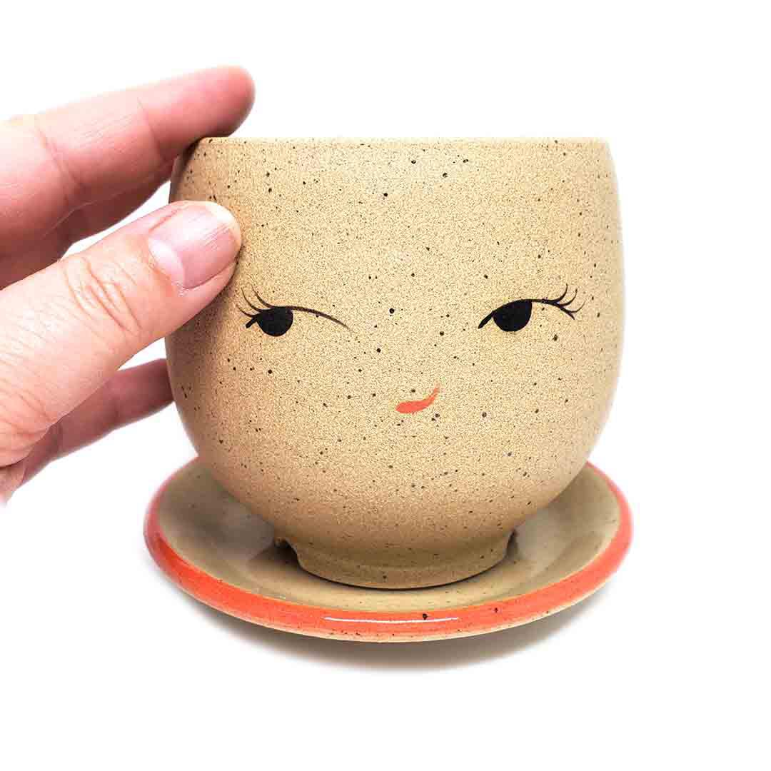 Planter - Coy Face (Red Saucer) by Jennifer Fujimoto