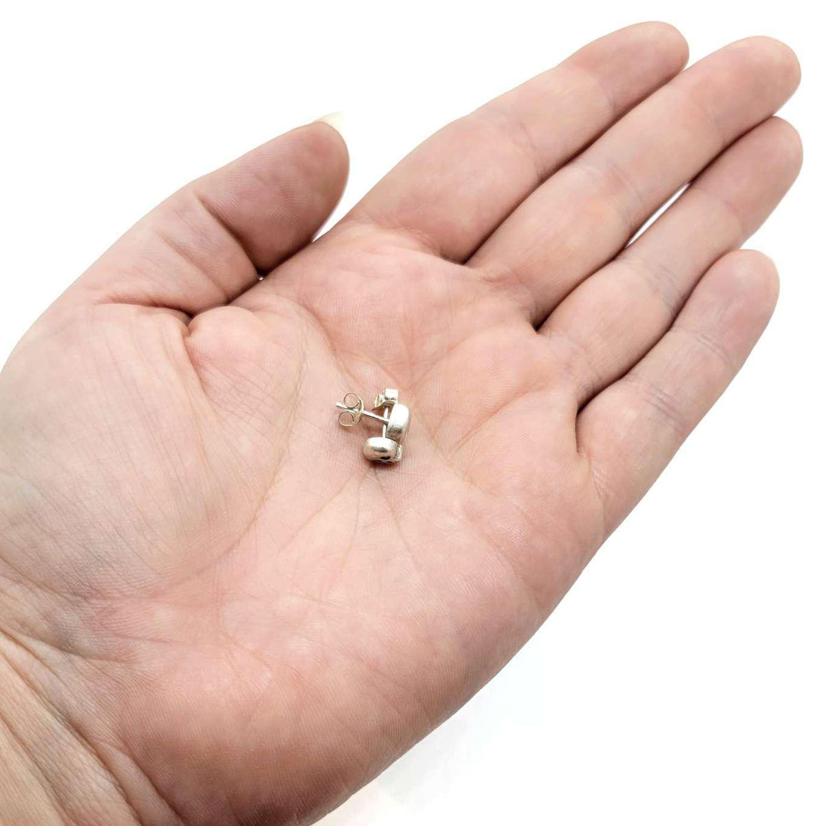 Earrings - Diamond-Eyed Tiny Skull Studs in Sterling Silver by Michelle Chang