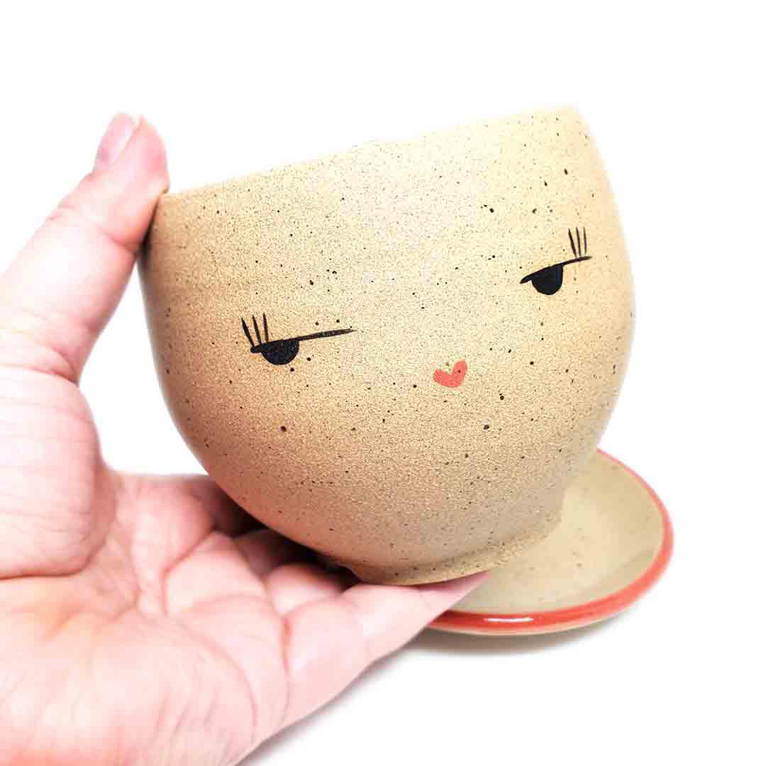 Planter - Side Eye Face (Red Saucer) by Jennifer Fujimoto